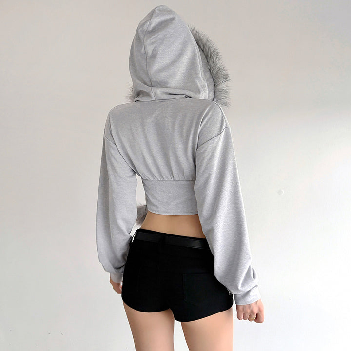 Women's cropped hoodie sweatshirt with faux fur trim, zipper, and pom-pom cords Mune Fashion