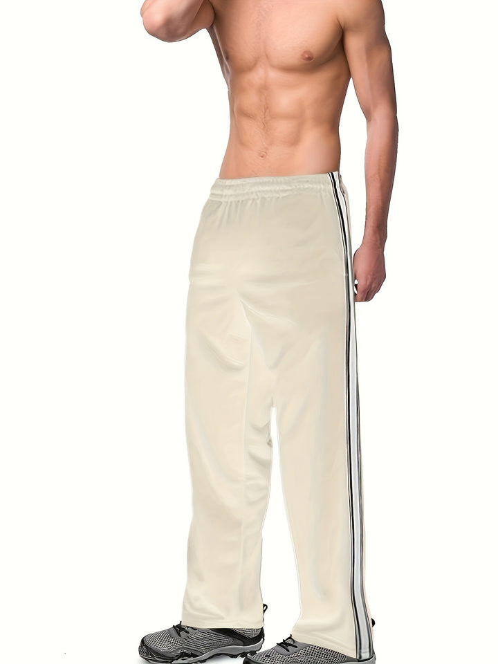 Men's sporty training pants with side tape stripes and elastic waistband Mune Fashion