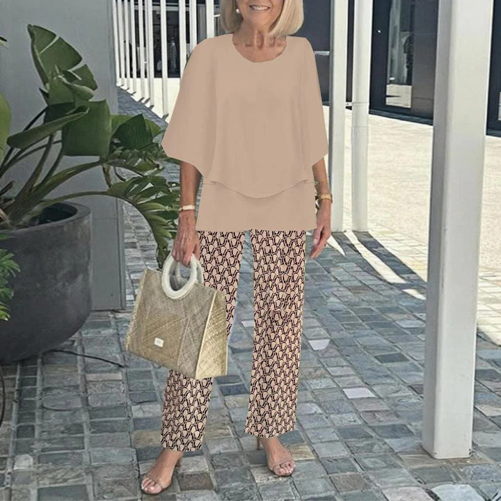 Women's layered tunic with cape sleeves and ankle-length straight leg pants with graphic print Mune Fashion