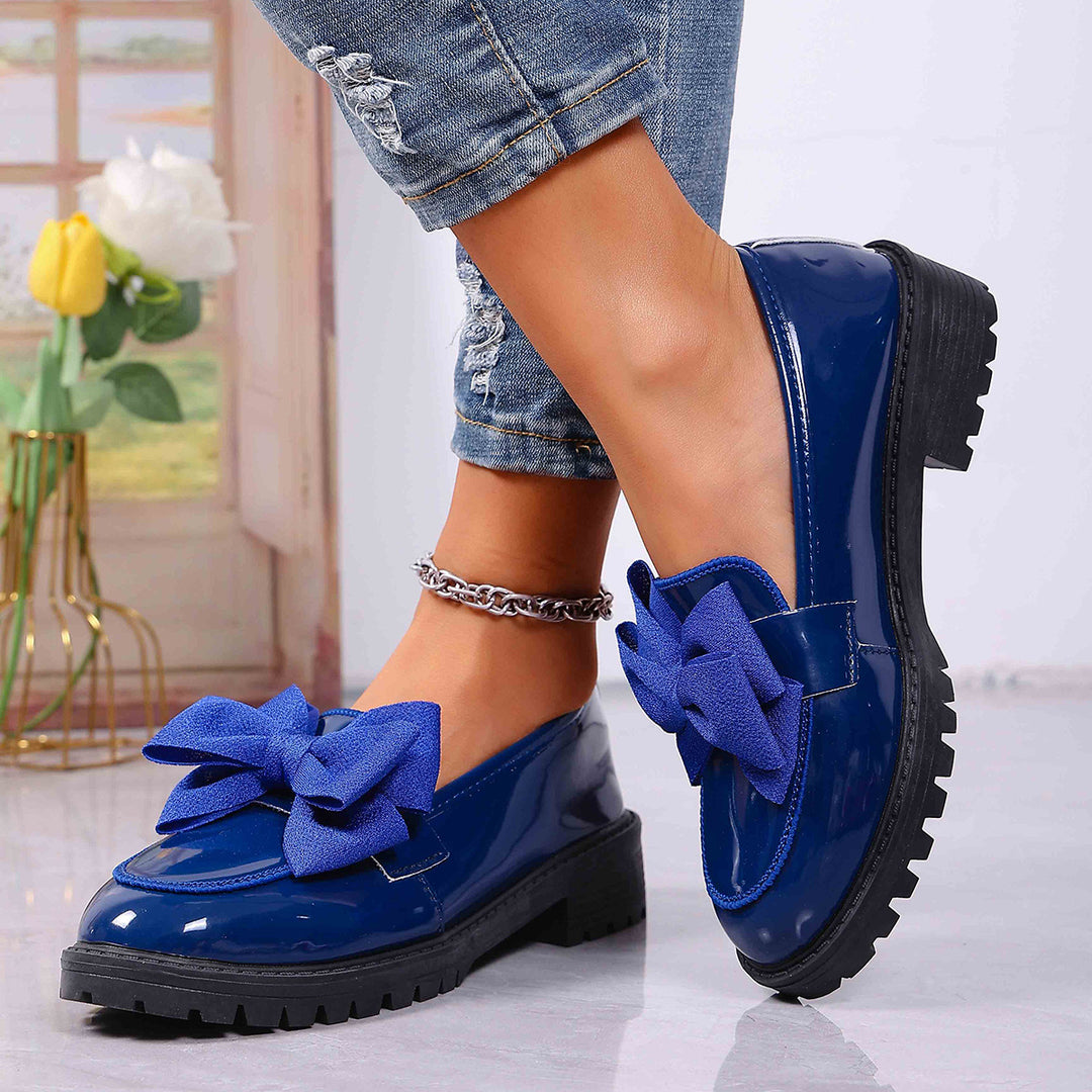 Women's patent leather platform loafers with patterned rubber sole and decorative bow Mune Fashion