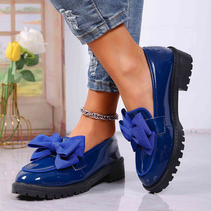 Women's patent leather platform loafers with patterned rubber sole and decorative bow Mune Fashion