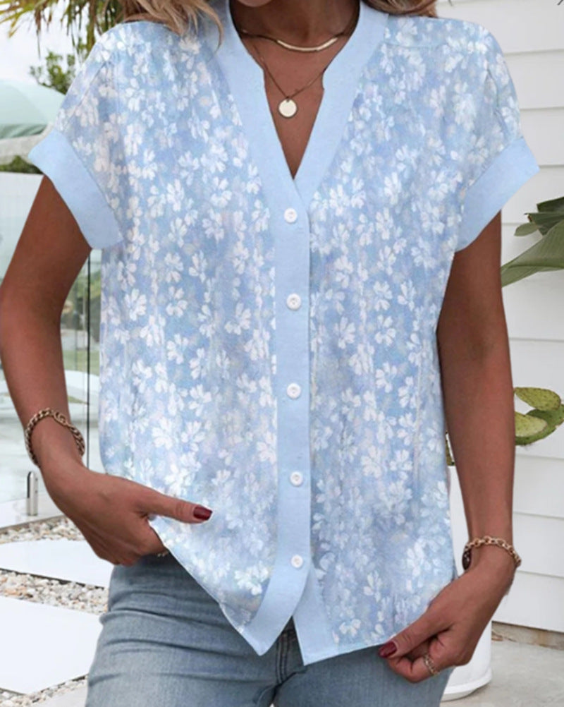 Women's airy button blouse with V-neck, rolled sleeves and floral textured print Mune Fashion