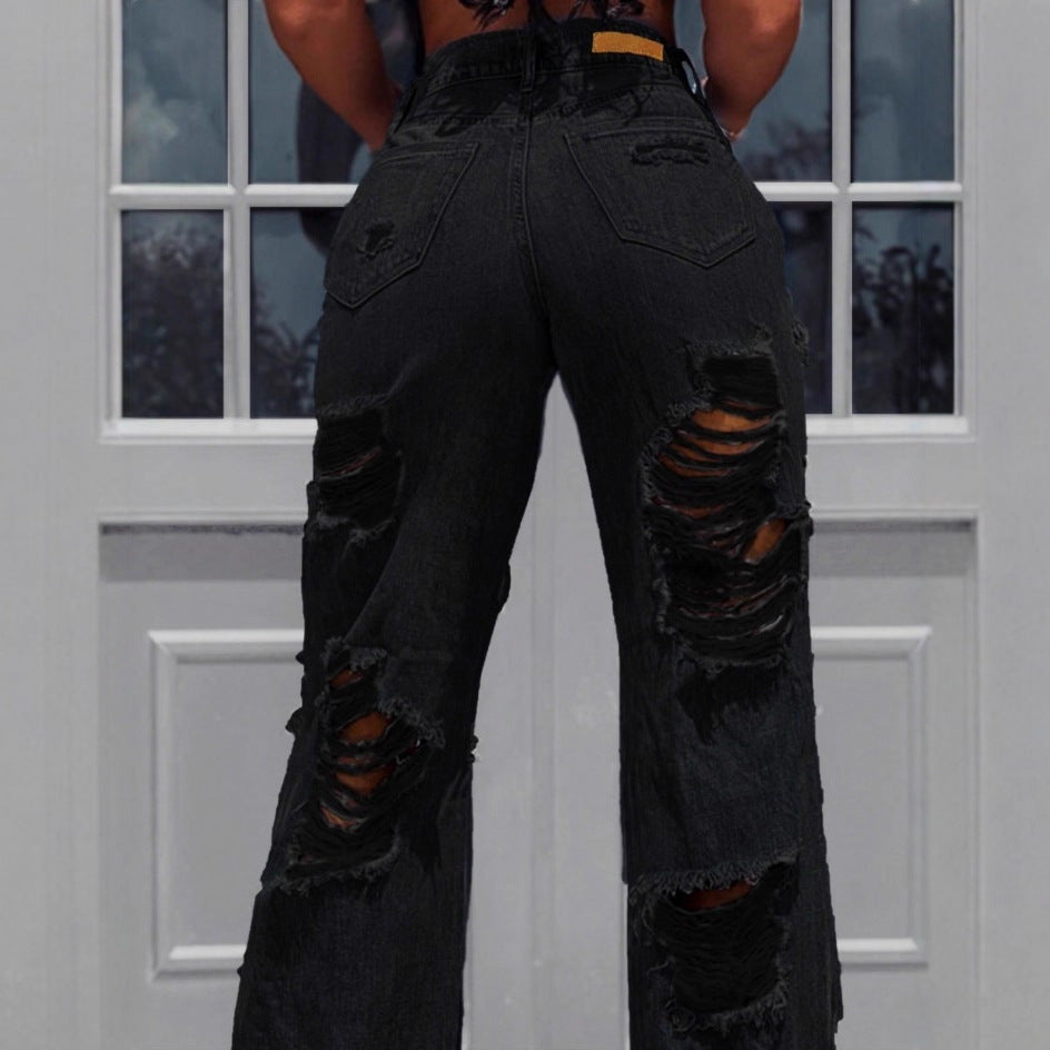 Ladies high-waisted destroyed jeans with wide legs and large knee rips Mune Fashion