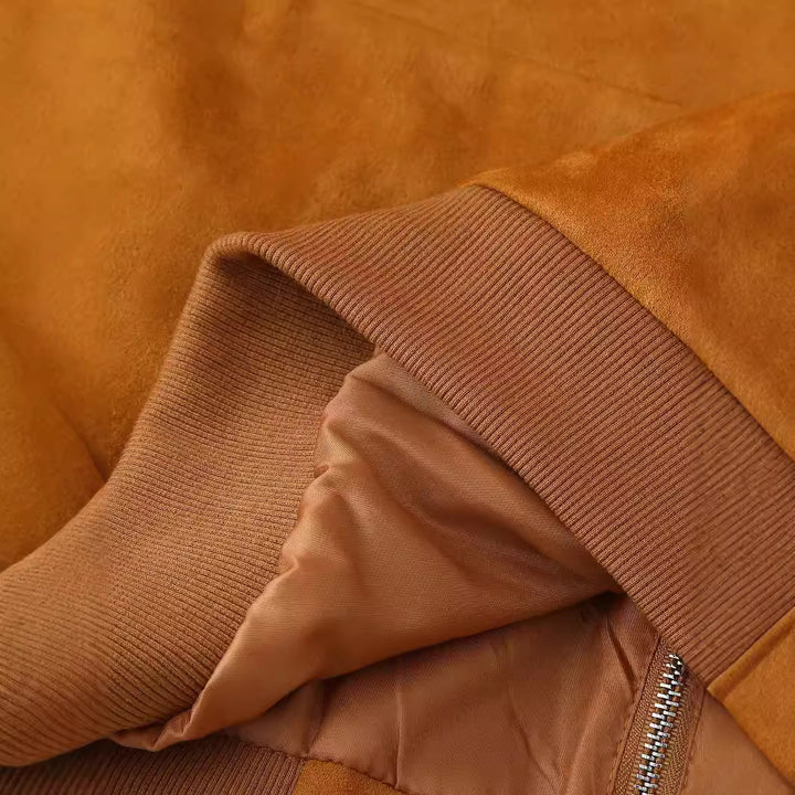 Women's nan kastiger velour bomber with chest flaps, concealed zipper, and ribbed cuffs Mune Fashion
