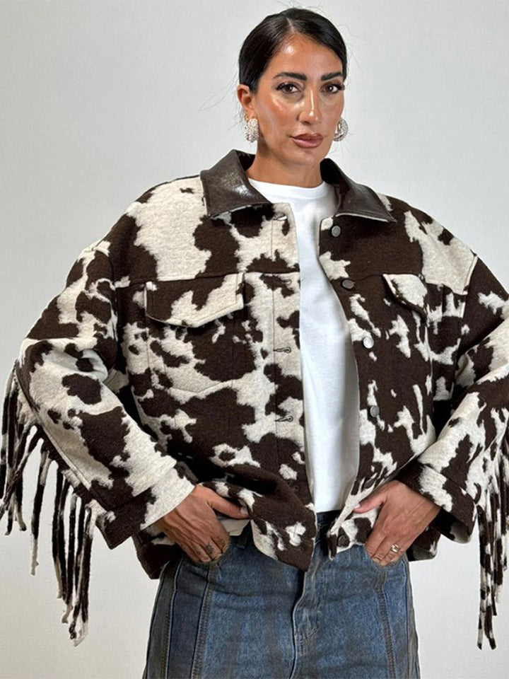 Ladies short jacket in cow print with fringes, faux fur look and leather collar Mune Fashion