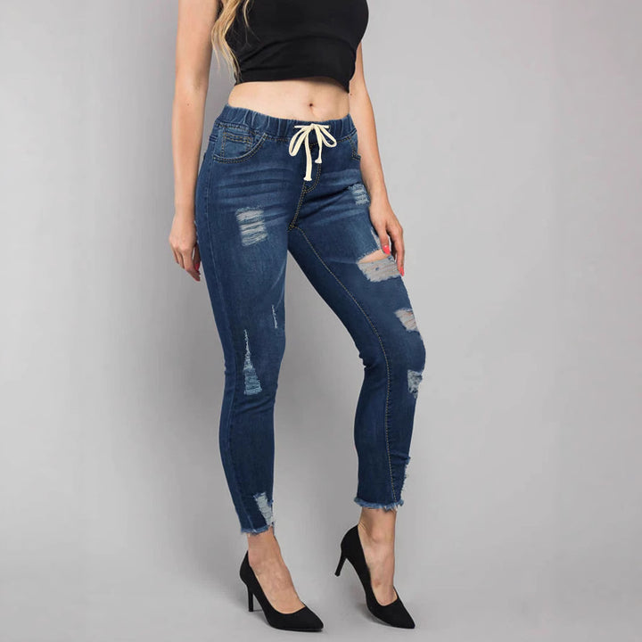 Women High-Waisted Destroyed Jogger Jeans with Elastic Drawstring Waistband and Cropped Frayed Hem Mune Fashion