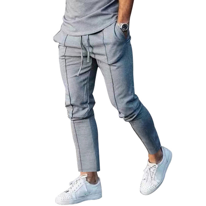 Men's Slim Tapered Jogging Pants with decorative stitching, elastic drawstring, and narrow ankle cuffs Mune Fashion
