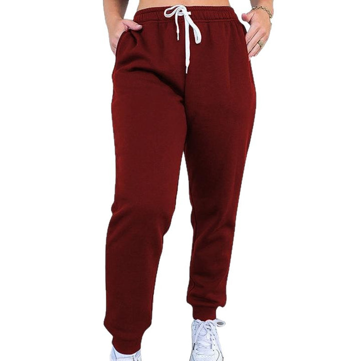 Women's tapered jogging pants at ankle height with elastic comfort waistband, adjustable drawstring, and deep side pockets Mune Fashion