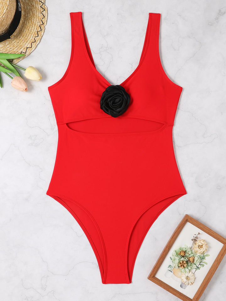 Damen Sportlicher Badeanzug mit stylischem Schnitt und Blumenapplikation Echo Archiv