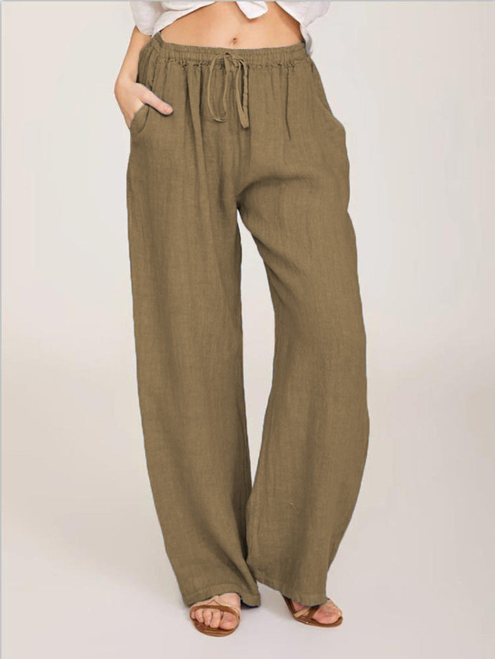 Women's airy palazzo pants with drawstring waistband, elastic waist finish, and side pockets Mune Fashion