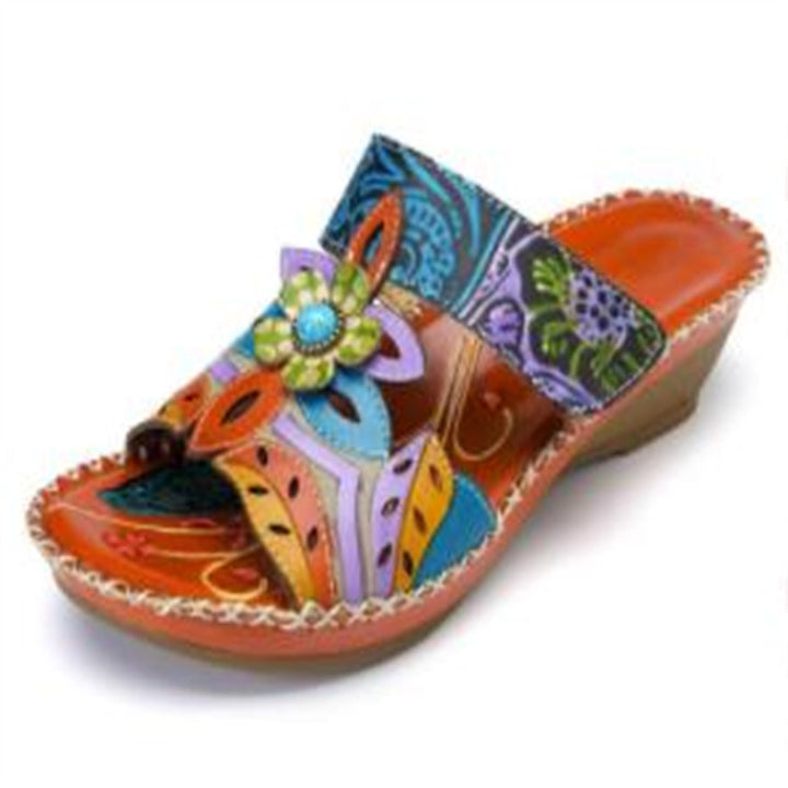Ladies wedge slide with floral decor and handcrafted leather applications Mune Fashion