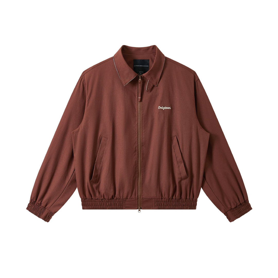 Men's short cut boxy blouson with high stand-up collar, elastic hem and zipper front.