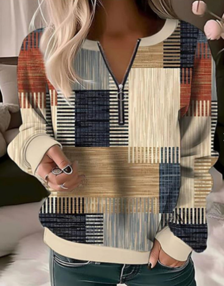 Women's cozy sweater with short zip, graphic patchwork pattern, extended sleeve cuffs, and ribbed hem Mune Fashion