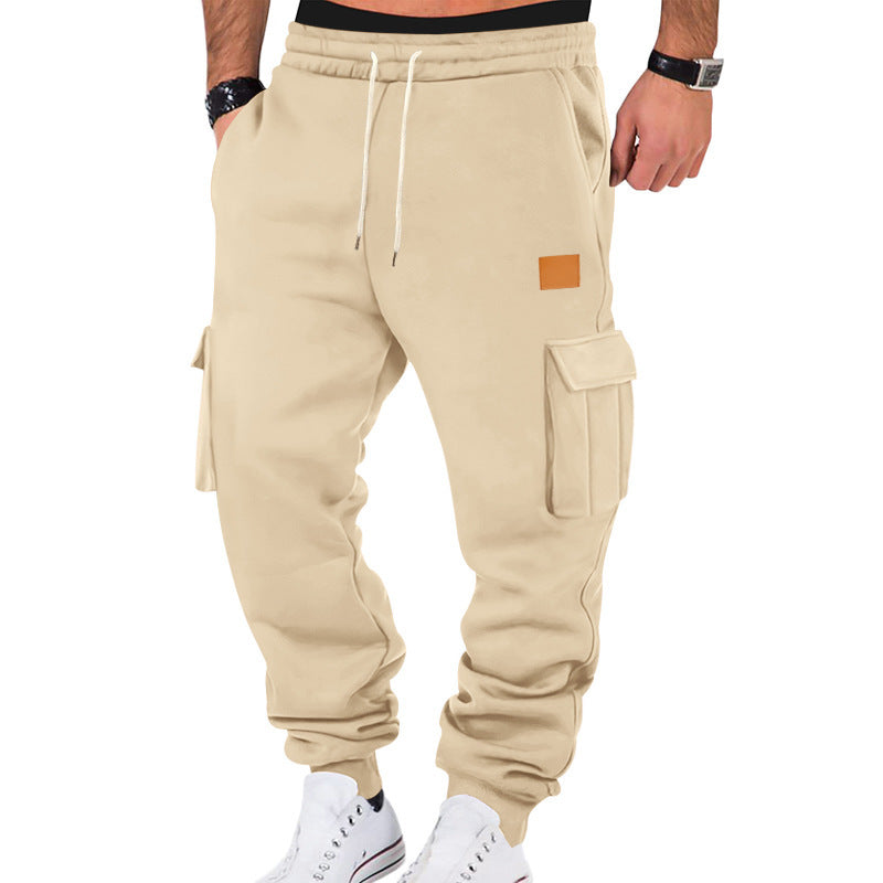 Men's tapered utility sweatpants with large flap pockets, elastic drawstring waistband, and ribbed leg cuffs Mune Fashion