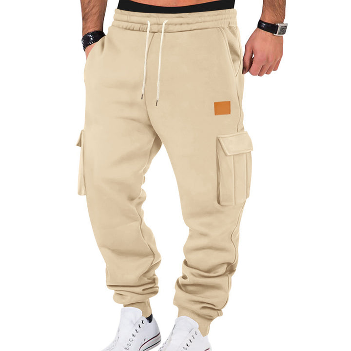 Men's tapered utility sweatpants with large flap pockets, elastic drawstring waistband, and ribbed leg cuffs Mune Fashion