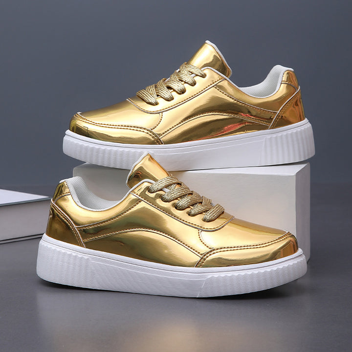 Ladies' low-cut sneakers with reflective patent upper, padded shaft, and raised outsole with groove profile Mune Fashion