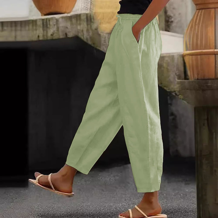 Women's loose-fitting linen blend pants with elastic waistband, drawstring, and angled side pockets Mune Fashion
