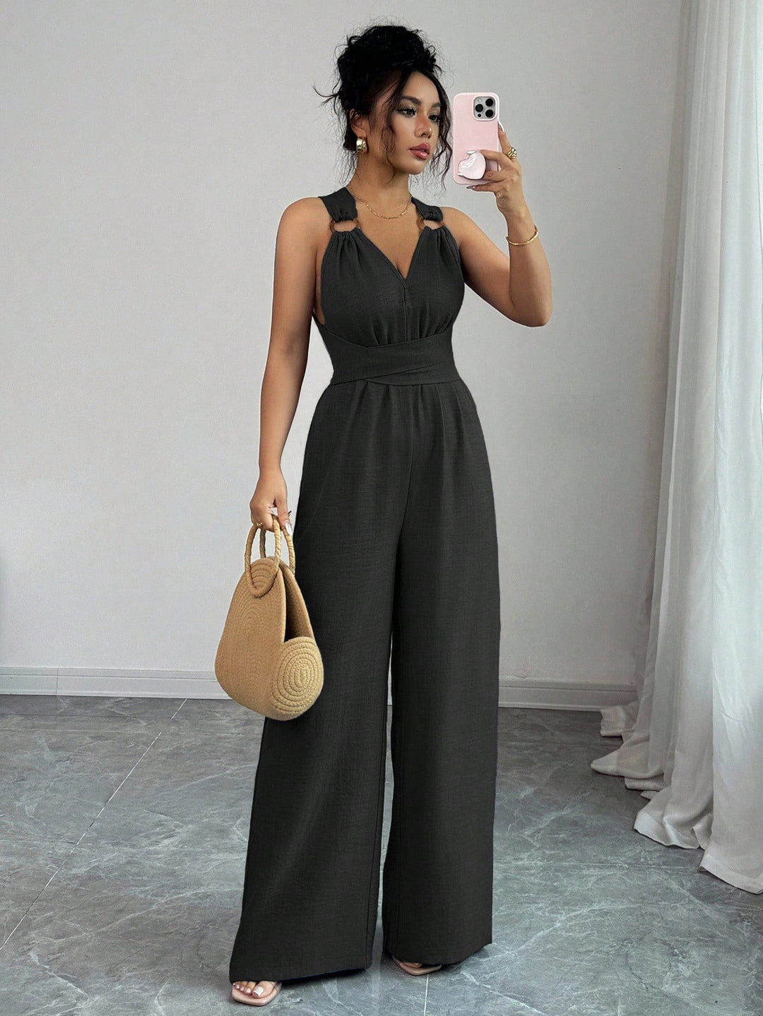 Women’s jumpsuit with wide leg, tailored wrap belt and eyelet straps Mune Fashion