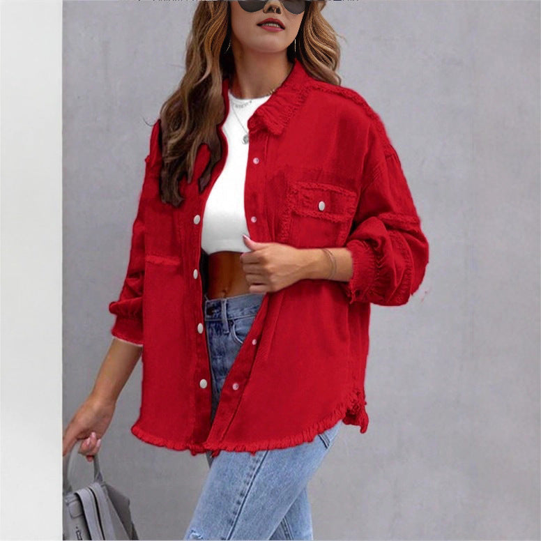Women's oversized denim shirt jacket with fringe trim, flap pockets, and snap front Mune Fashion