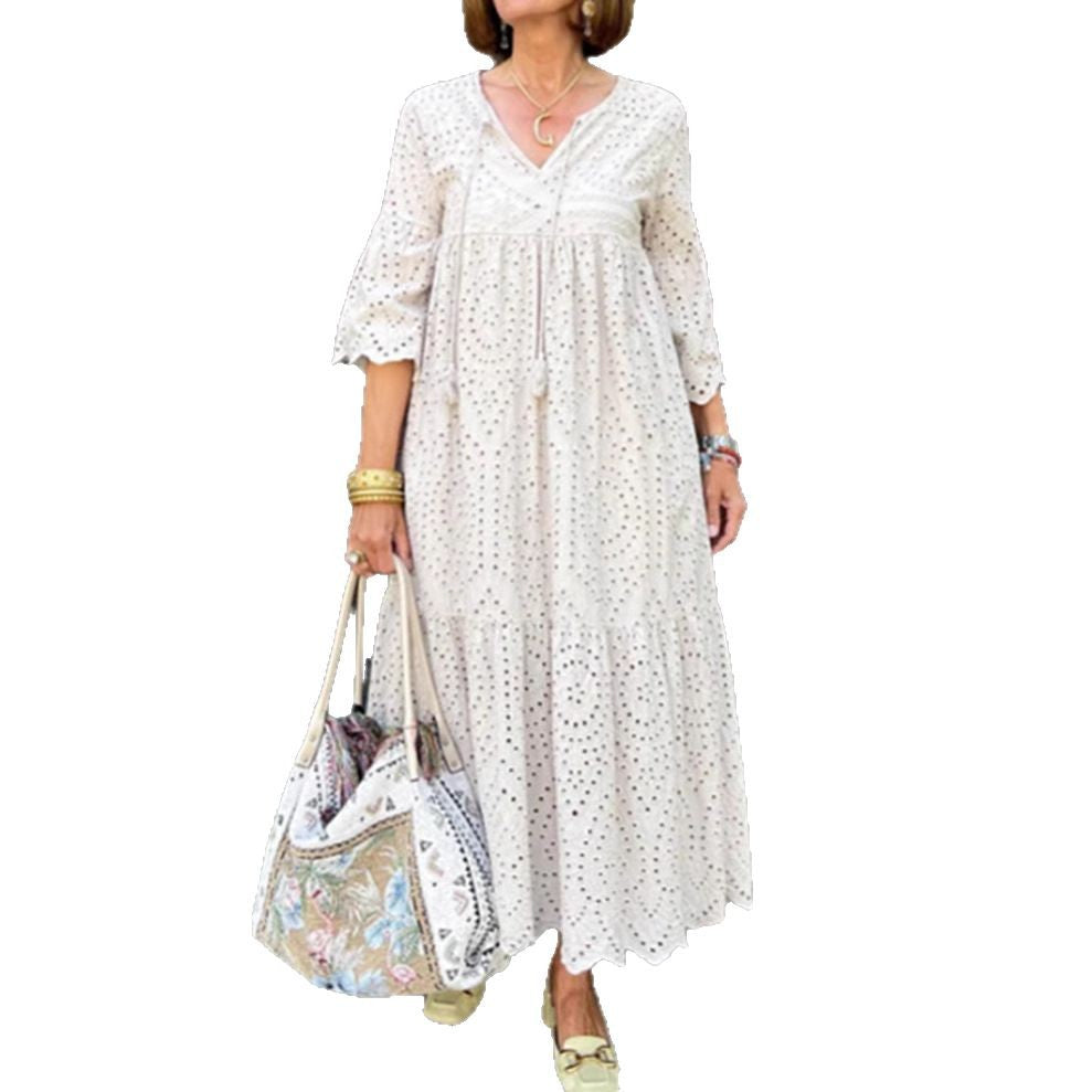 Women's flowing maxi dress with openwork embroidery, V-neck, underbust seam, and ruffled skirt Mune Fashion