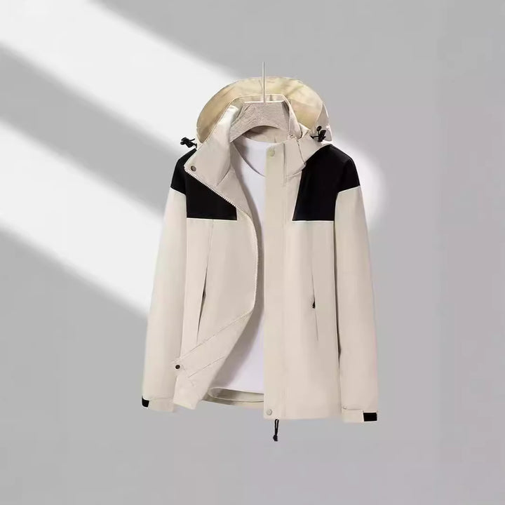 Men's lightweight softshell jacket with contrasting shoulder panel, adjustable hood, and Velcro cuffs Mune Fashion