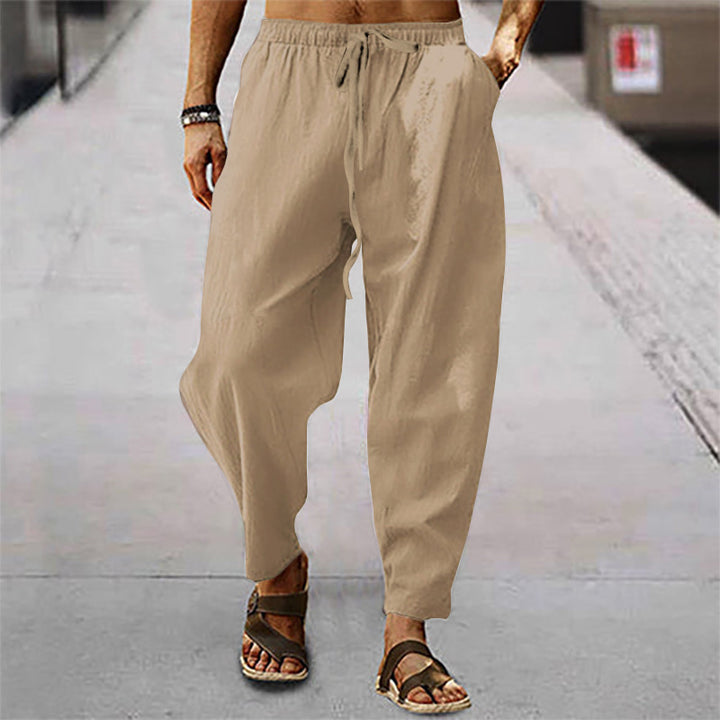 Men's relaxed summer slouch pants made of linen blend with elastic waistband and tapered ankle cuffs Mune Fashion