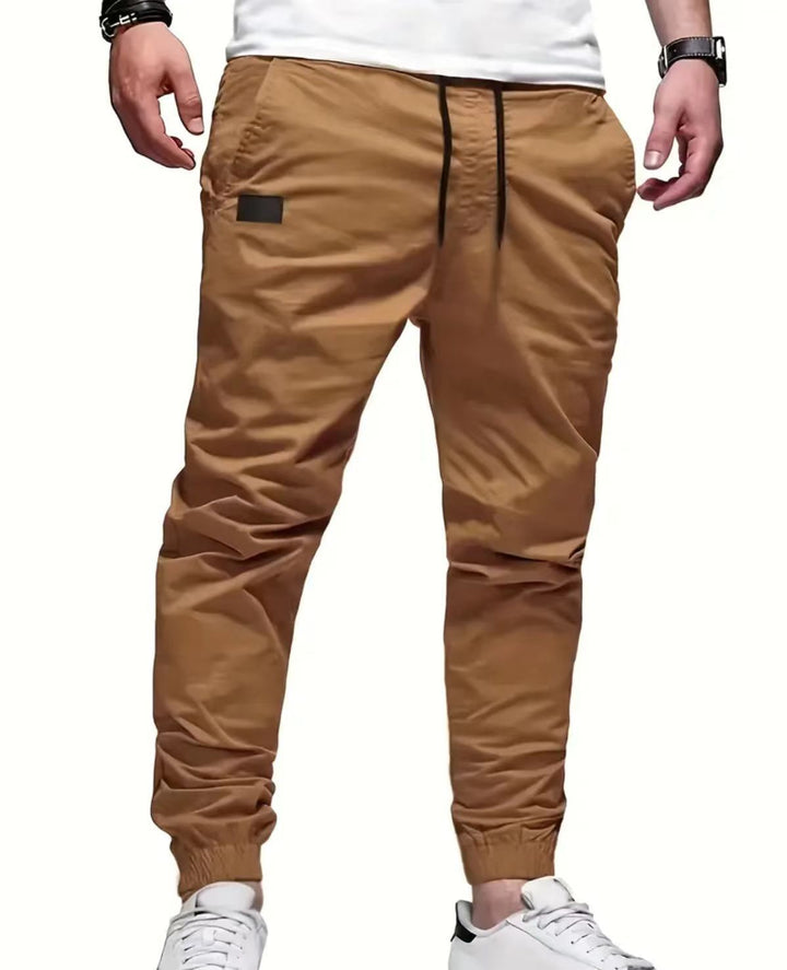 Men's urban tapered twill joggers with elastic ankle cuffs, drawstring waistband and discreet utility pocket Mune Fashion