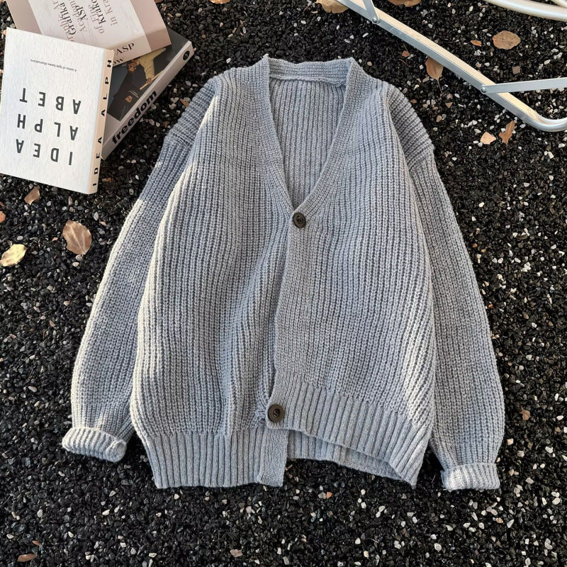 Unisex chunky knit cardigan in oversized cut with deep V-neck and distinctive button placket Mune Fashion