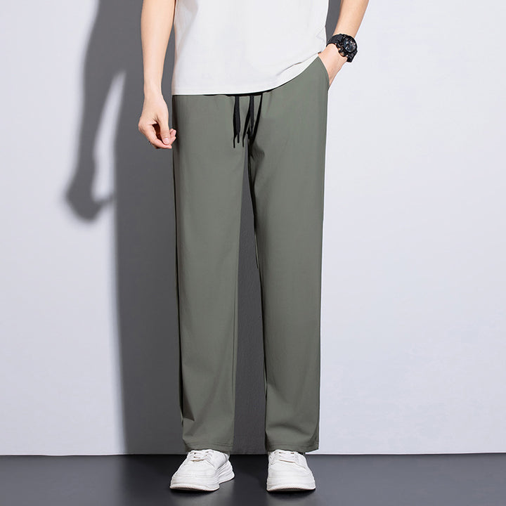 Men's sporty training pants with elastic waistband and practical pockets Mune Fashion