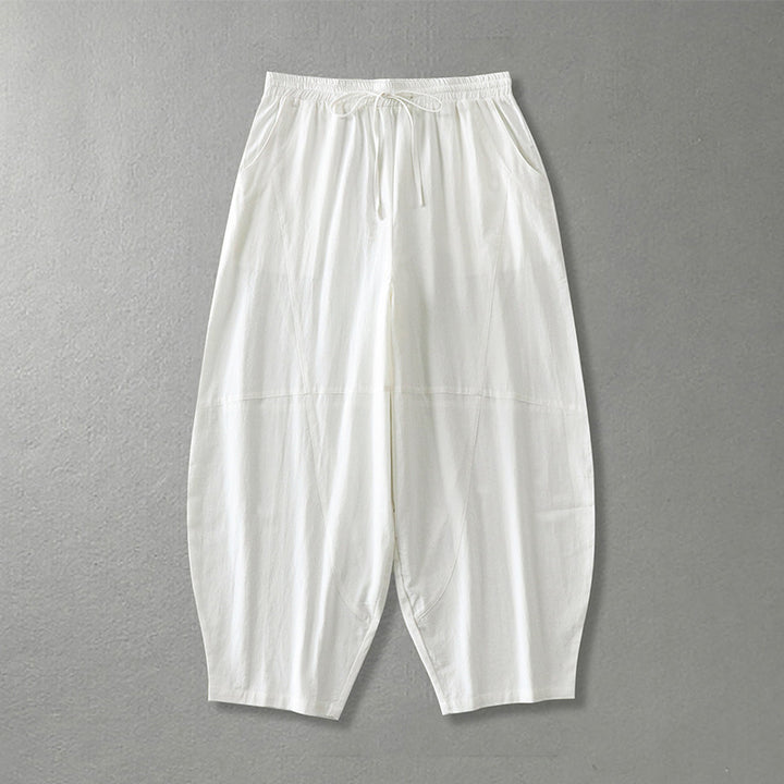 Women's wide harem pants made of lightweight satin with drawstring and side pockets Mune Fashion