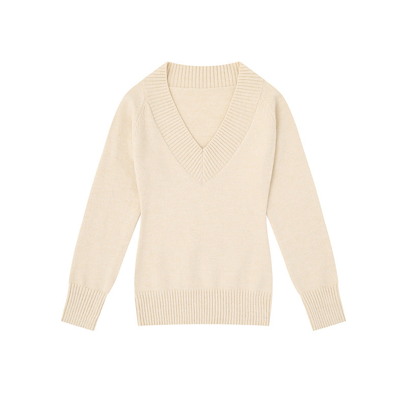 Women's fine knit pullover with deep V-neck, wide ribbed hem, and relaxed fit Mune Fashion