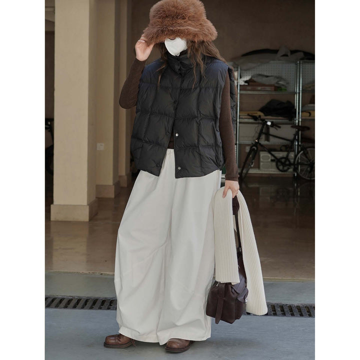 Women's lightweight quilted vest with high collar and snap button placket Mune Fashion