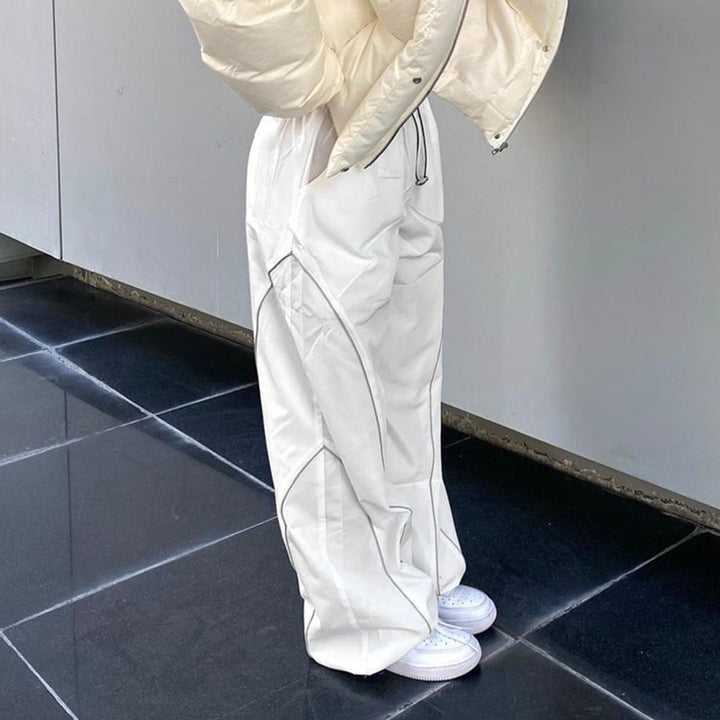Women wide track pants with drawstring waistband, contrast seam design, and adjustable hem cords Mune Fashion