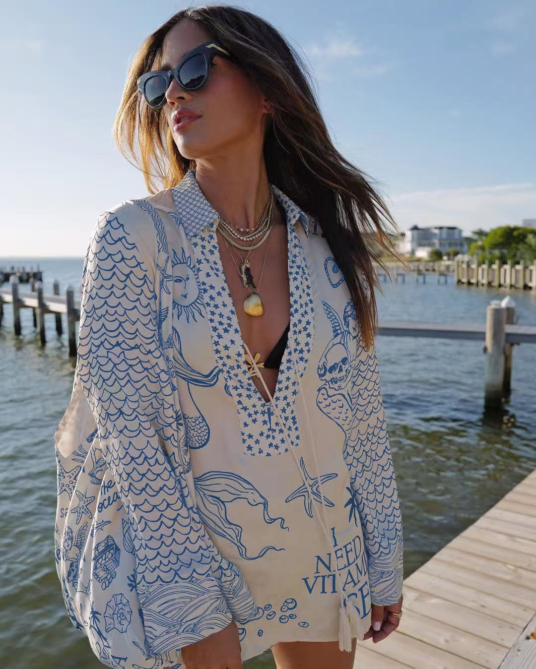 Ladies lightweight beach cover-up in tunic form with deep V-neck, tassel closure, and nautical ocean print Mune Fashion