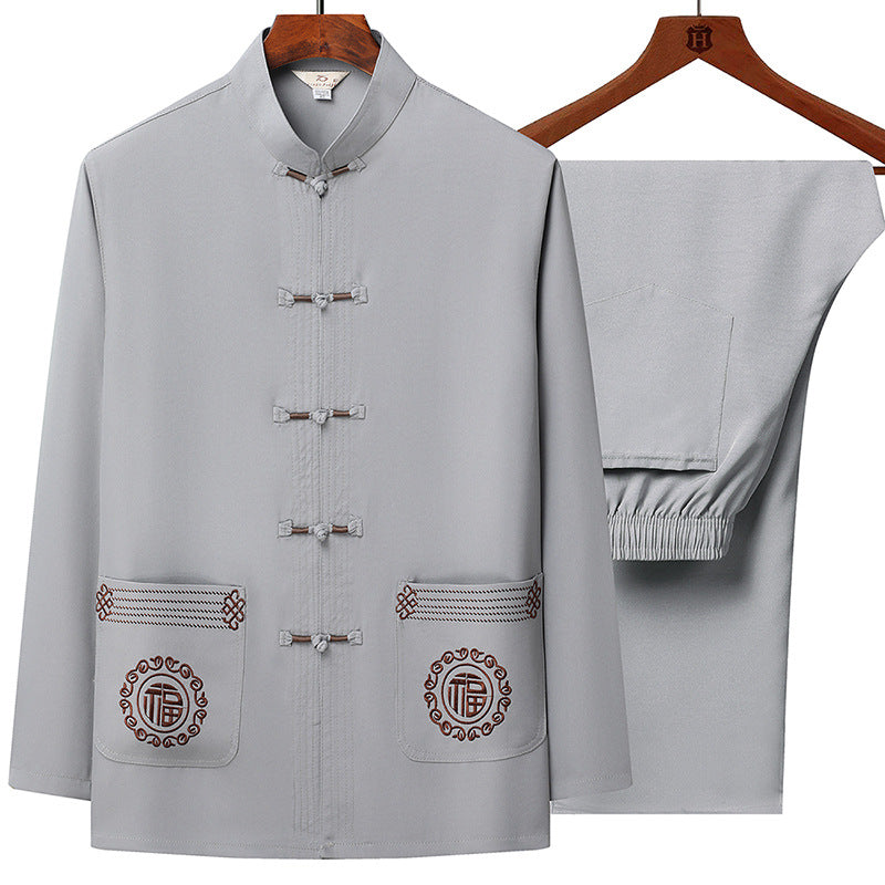 Men's traditional Tang suit set with stand collar, knot closures, and subtle embroidery details Mune Fashion