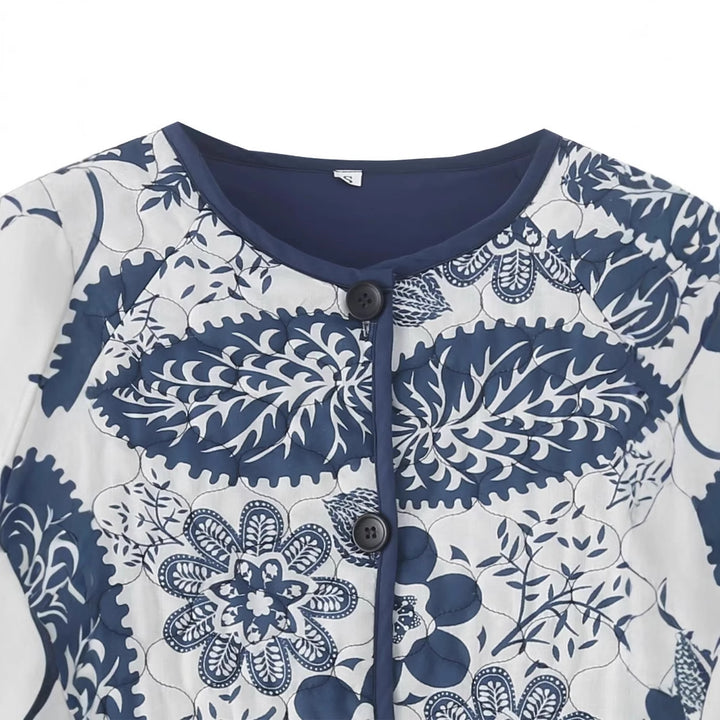 Women's nan quilted jacket with floral patchwork print, round button placket and rounded hem Mune Fashion