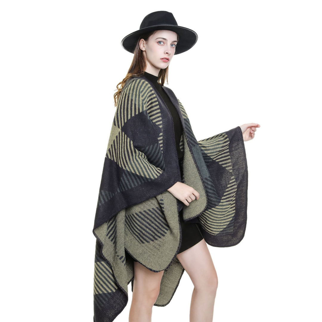 Women’s cape poncho made of wool blend with geometric striped jacquard and open edge seam Mune Fashion