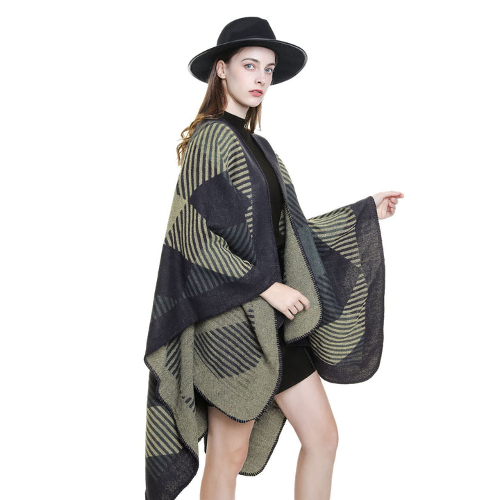 Women’s cape poncho made of wool blend with geometric striped jacquard and open edge seam Mune Fashion