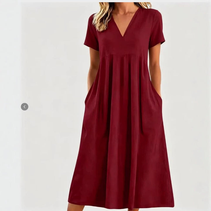 Women nan legeres V-neck midi dress with side pockets and gathered empire seam Mune Fashion