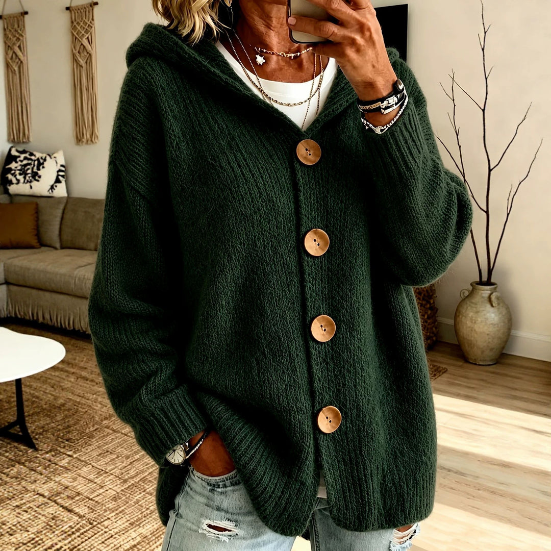 Women's chunky knit hooded cardigan with oversized silhouette, wooden button placket and ribbed cuffs Mune Fashion