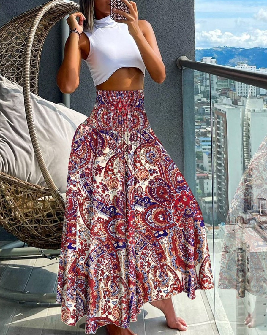 Women's maxi skirt with high smocked waistband, wide fall, and paisley print Mune Fashion