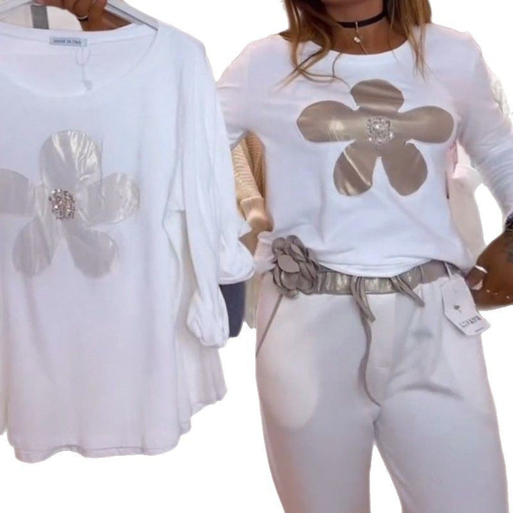 Women's locker-cut longsleeve with metallic flower appliqué and decorative centerpiece Mune Fashion