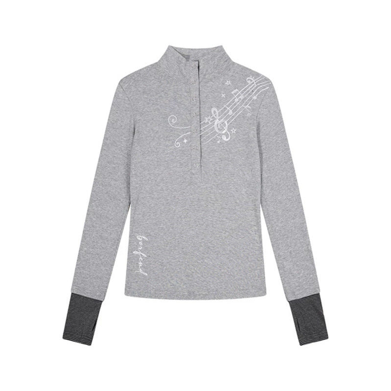 Women’s long-sleeve shirt with Henley button placket, contrast cuffs, and music note print Mune Fashion