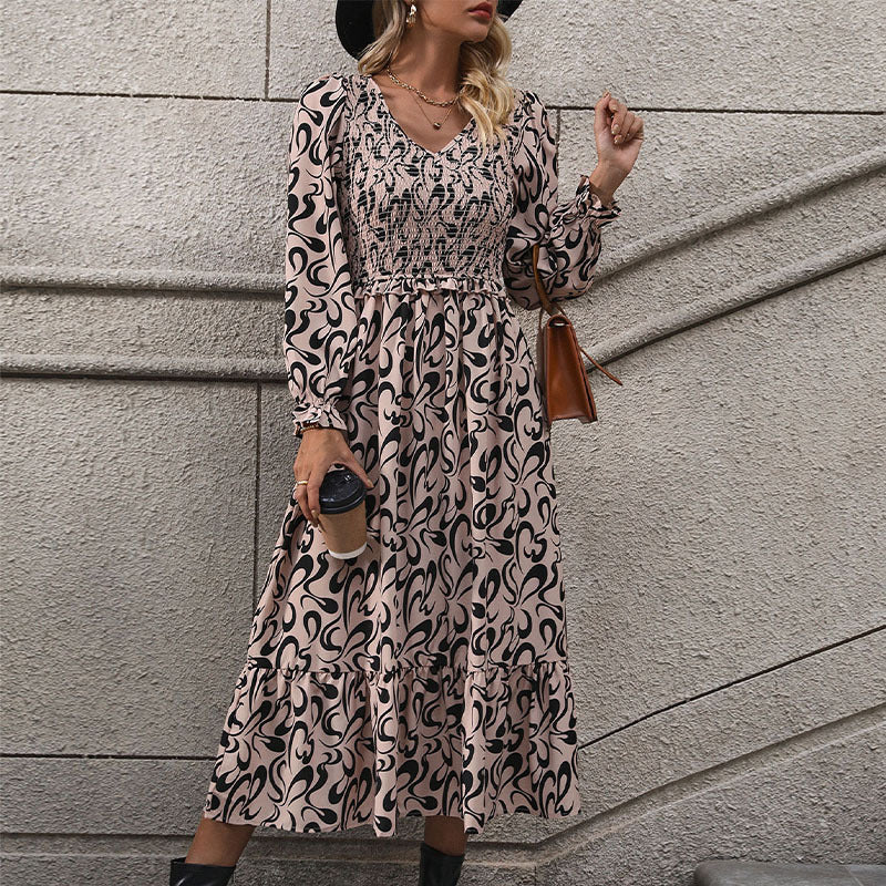 Women’s midi dress with elastic smock top, abstract all-over print and flared ruffle hem Mune Fashion