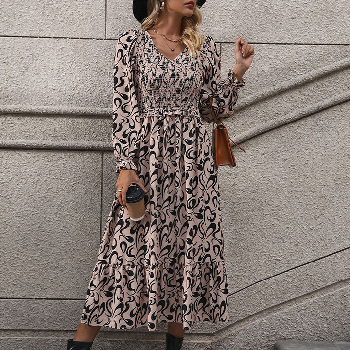Women’s midi dress with elastic smock top, abstract all-over print and flared ruffle hem Mune Fashion
