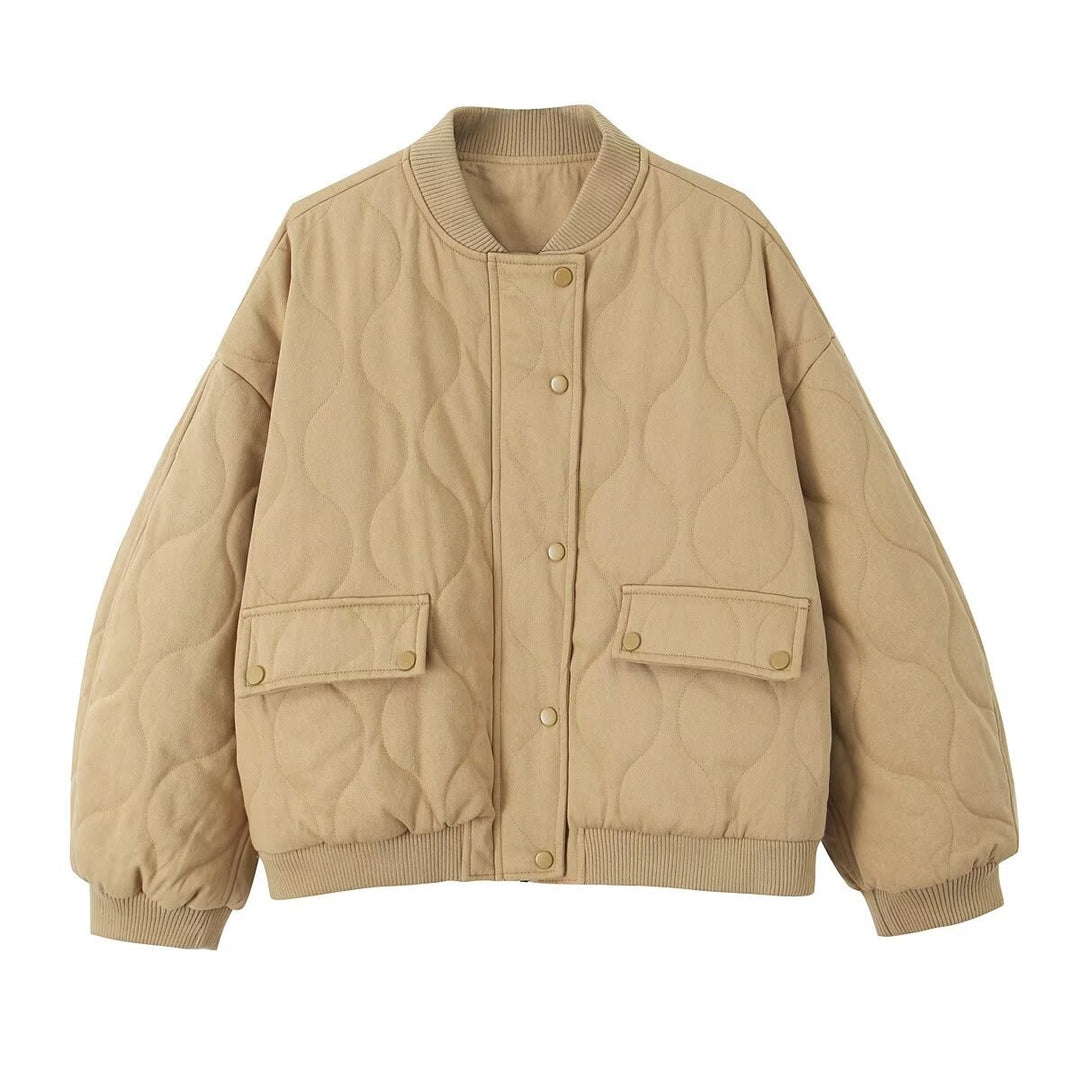 Women's quilted bomber jacket with oversized silhouette, ribbed cuffs, and flap pockets Mune Fashion