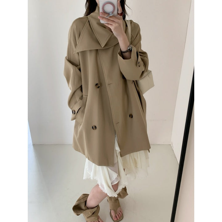 Women’s short trench coat with extra wide lapels, raglan sleeves, and horn button details Mune Fashion