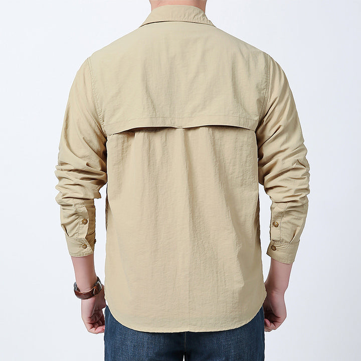 Men's long-sleeved field shirt made of lightweight ripstop with multifunctional chest pockets and concealed zip.