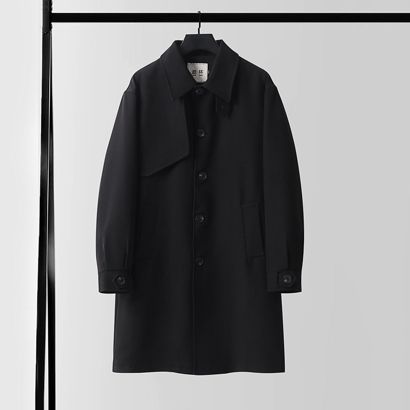 Men's modern minimalist trench coat with asymmetric shoulder flap and knee-length silhouette Mune Fashion