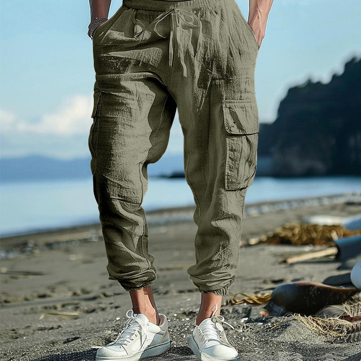 Men's casual cargo pants in jogger style with crinkle linen look, drawstring waistband, and multiple pockets Mune Fashion
